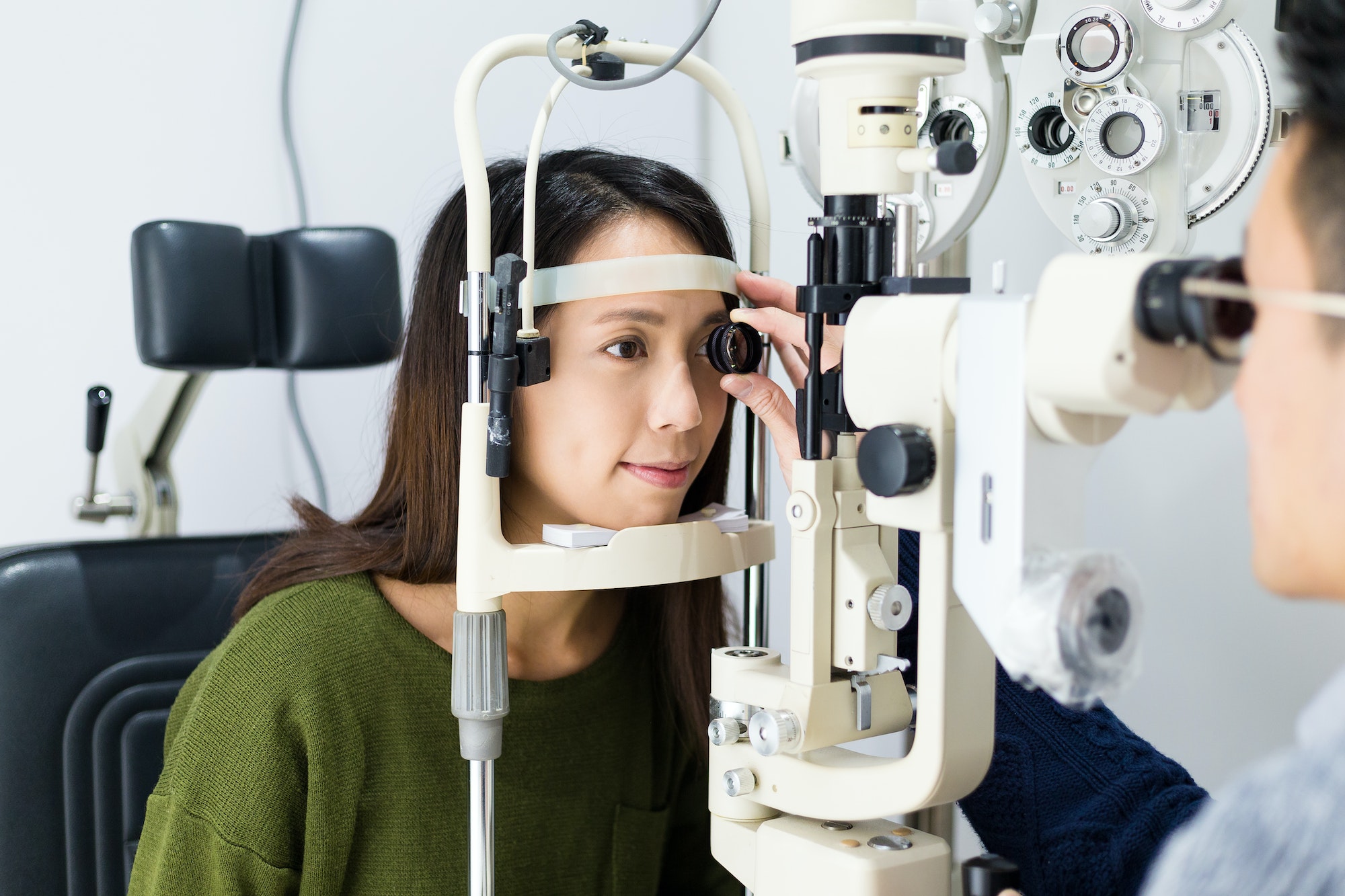 woman-checking-vision-with-tonometer-at-optical-clinic.jpg